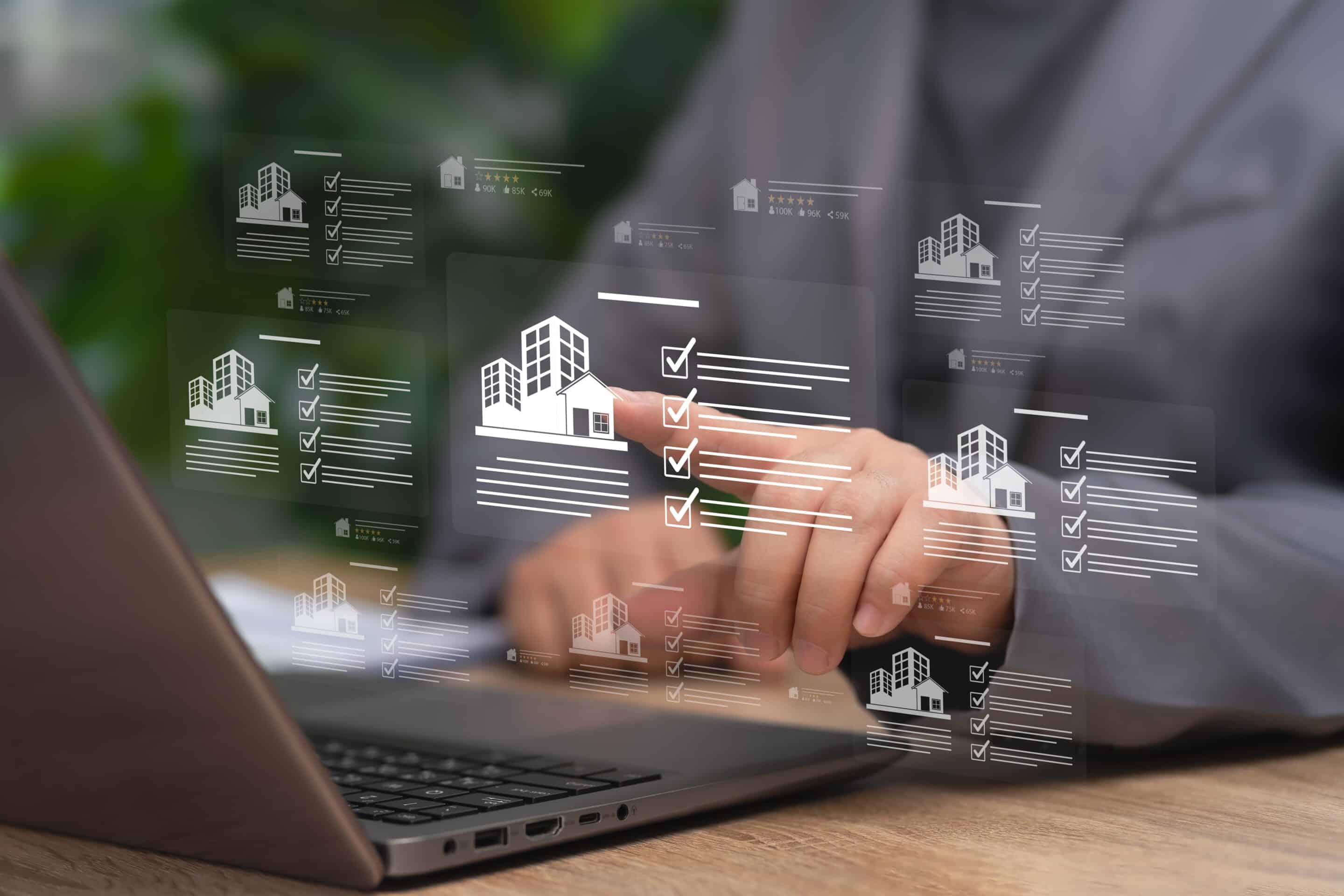 Gestion d’un portefeuille immobilier sur interface digitale illustrant la structuration d’une holding et de ses filiales